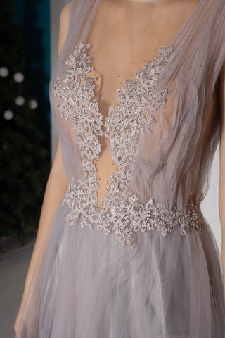 Mauve tiered tulle evening gown with illusion deep V-neckline, floral embroidery, and tiered skirt.