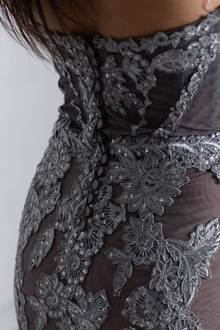 Silver strapless lace evening gown with sweetheart neckline and mermaid silhouette.