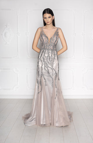 Silver beaded evening gown with plunging V-neckline, sleeveless design, and mermaid silhouette.